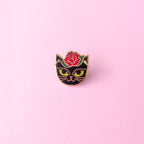 Cat head inspired by Fridah Kahlo with little gold hoop earrings