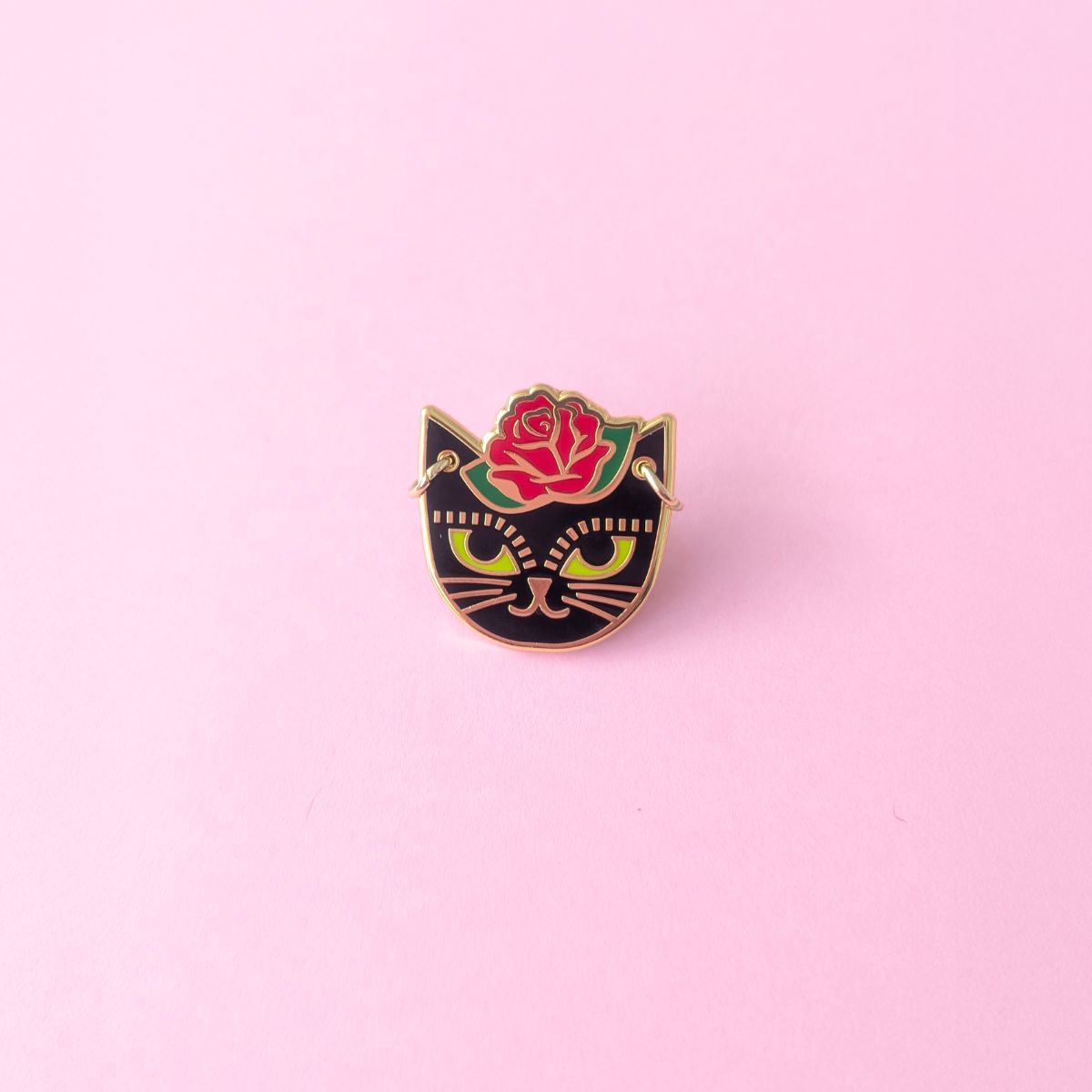 Cat head inspired by Fridah Kahlo with little gold hoop earrings