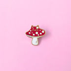 A red cat mushroom with white spots