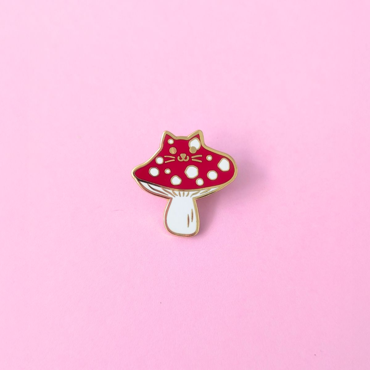 A red cat mushroom with white spots