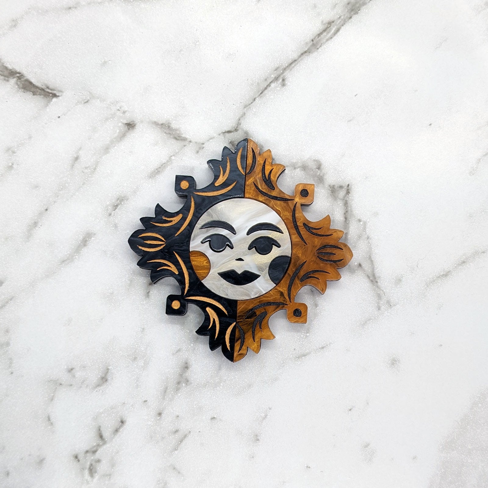 Eclipse brooch